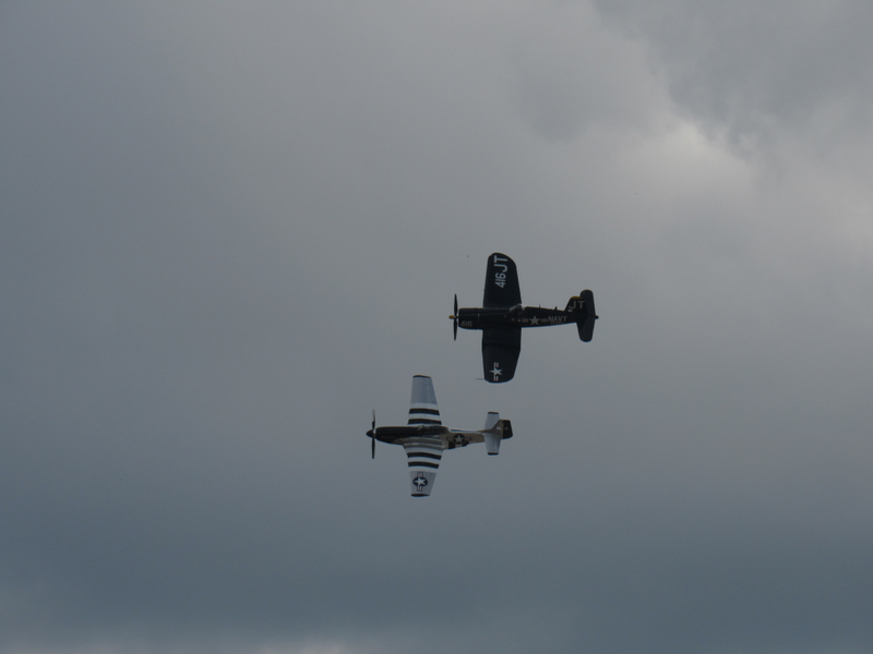 Two planes, from two services, that fought on two different fronts: a Navy F4U Corsair and an Army Air Corps P-51 Mustang.